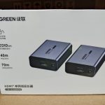 UGREEN HDMI Over Ethernet Extender 1080P 70M kit showing transmitter and receiver units with aluminum housing, HDMI ports, RJ45 Ethernet ports, and included power adapters.