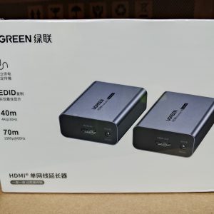 UGREEN HDMI Over Ethernet Extender 1080P 70M kit showing transmitter and receiver units with aluminum housing, HDMI ports, RJ45 Ethernet ports, and included power adapters.