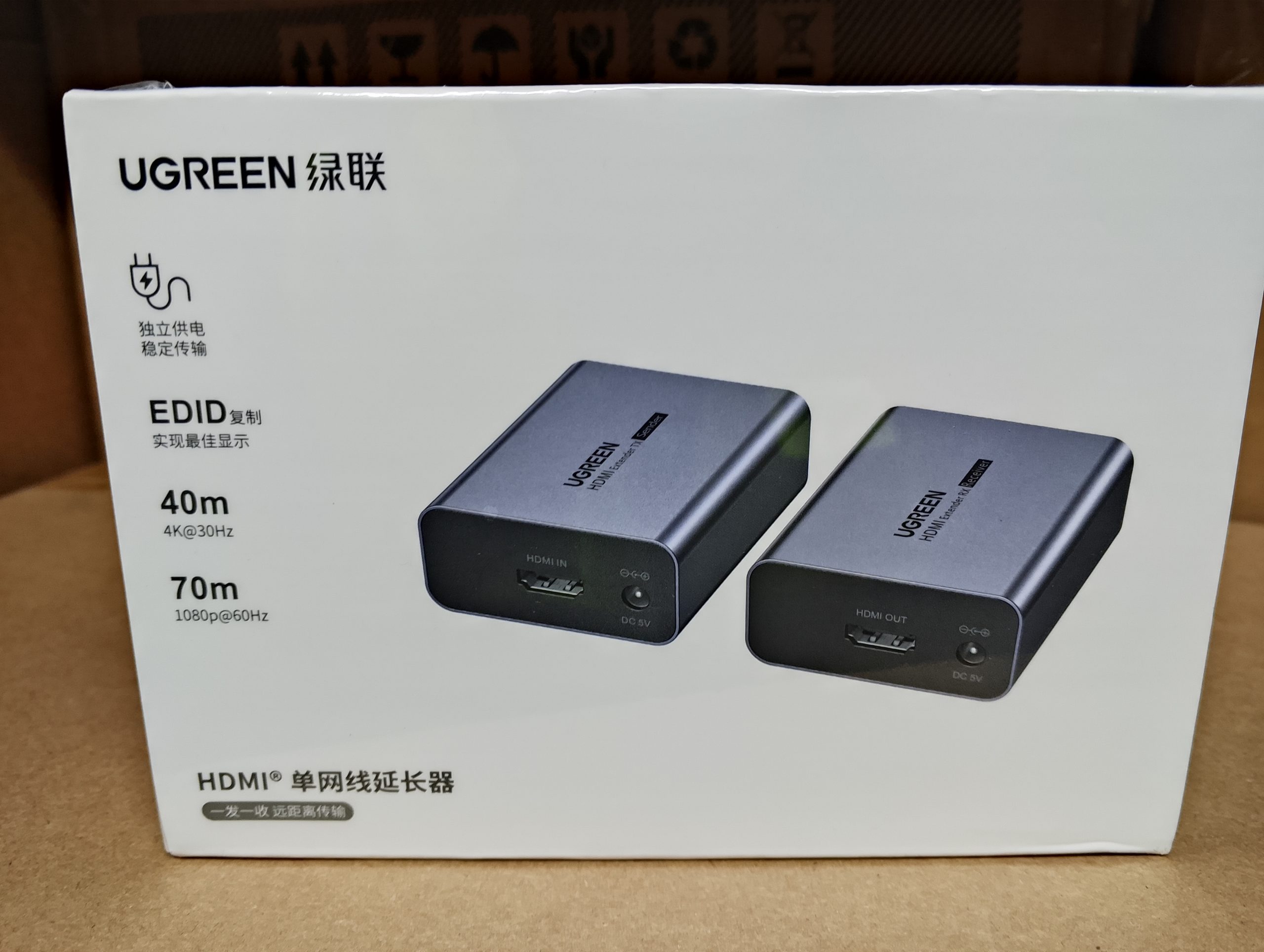 UGREEN HDMI Over Ethernet Extender 1080P 70M kit showing transmitter and receiver units with aluminum housing, HDMI ports, RJ45 Ethernet ports, and included power adapters.
